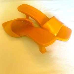 Orange leather slide heels from Anthropologie